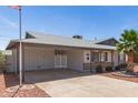 Single-story home featuring a covered carport and desert landscaping at 5243 W Vernon Ave, Phoenix, AZ 85035