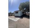 Single-story mobile home featuring brick trim and desert landscaping at 6439 W Myrtle Ave # 49, Glendale, AZ 85301