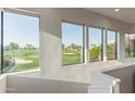 Picturesque golf course view from interior windows, offering a serene and scenic backdrop at 7222 E Gainey Ranch Rd # 245, Scottsdale, AZ 85258