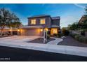 Charming two-story home featuring a three-car garage, well-manicured landscaping, and a welcoming entrance at 7230 W Pershing Ave, Peoria, AZ 85381