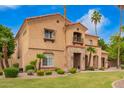 Charming two-story home with a red tile roof, stone accents, and lush landscaping at 7236 W Electra Ln, Peoria, AZ 85383