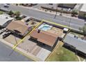 Aerial view of a single Gathering home featuring a backyard pool and generous lot at 724 N Pine St, Gilbert, AZ 85233