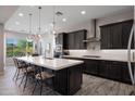 Stylish kitchen featuring a large island, pendant lighting, and stainless steel appliances at 8040 E Jaeger St, Mesa, AZ 85207
