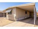 Exterior view of a single-story home with a covered carport at 11411 N 91St Ave # 28, Peoria, AZ 85345