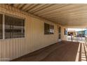 Spacious covered patio and windows along the side of a single-story home at 11411 N 91St Ave # 28, Peoria, AZ 85345