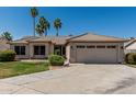 Attractive single-story home with an attached two-car garage and tiled roof at 1343 W San Carlos Pl, Chandler, AZ 85248