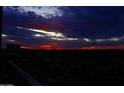 Dramatic sunset view from balcony with vibrant colors illuminating the horizon, creating a stunning skyline at 15215 N Kierland Blvd # 636, Scottsdale, AZ 85254