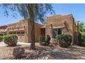 Charming single-story home featuring a well-manicured front yard and a two-car garage at 15674 W Mackenzie Dr, Goodyear, AZ 85395