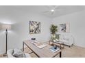 Comfortable office featuring a desk, couch, decorative pillows, and artwork for a welcoming and productive work space at 1727 E Chelsea Ln, Gilbert, AZ 85295