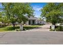 Charming single-story home with a lush front lawn and inviting curb appeal at 24434 S 201St Ct, Queen Creek, AZ 85142