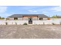 Stunning home with a sleek, modern exterior, walled perimeter, and desert landscaping at 26626 N 70Th Pl, Scottsdale, AZ 85266