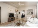 Open living space with tile floors, a decorative fireplace, and seamless flow into other areas at 3098 E Stottler Dr, Gilbert, AZ 85296