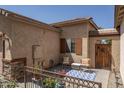 Cozy patio with a charming blue and white rug and comfortable seating for relaxing outdoors at 3098 E Stottler Dr, Gilbert, AZ 85296