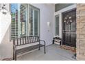 Cozy front porch with a bench, decorative door, and a textured wall finish at 3139 E Runaway Bay Pl, Chandler, AZ 85249