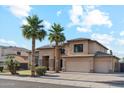 Beautiful two-story home featuring a spacious three-car garage and lush landscaping, under a sunny, partly cloudy sky at 3574 E Latham Way, Gilbert, AZ 85297