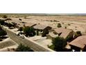 A picturesque aerial view of a charming neighborhood in a beautiful desert community at 44236 W Adobe Cir, Maricopa, AZ 85139