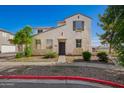 Charming two-story home featuring a desert-themed landscape and neutral color palette at 5104 W Fulton St, Phoenix, AZ 85043