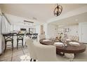 Stylish dining area that transitions to the modern kitchen area with barstool seating at 5166 N 83Rd St, Scottsdale, AZ 85250
