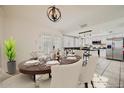 A dining area with french doors features stylish decor that transitions to the kitchen at 5166 N 83Rd St, Scottsdale, AZ 85250