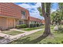 Charming townhome complex featuring well-maintained lawns, sidewalks, and distinctive red tile roofs at 5166 N 83Rd St, Scottsdale, AZ 85250