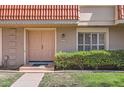 Charming townhouse with a unique red-tiled roof, welcoming front entrance, and well-manicured lawn at 5166 N 83Rd St, Scottsdale, AZ 85250