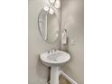 Bathroom featuring a pedestal sink and modern mirror at 6503 E Bluefield Ave, Phoenix, AZ 85054