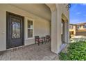 Inviting front porch with seating area and decorative door at 6503 E Bluefield Ave, Phoenix, AZ 85054
