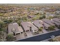 An aerial view showing the community layout and single-Gathering homes, each with tile roofs at 8433 E Leonora St, Mesa, AZ 85207
