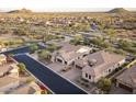 A beautiful neighborhood showcasing the expansive desert landscape and modern single-Gathering homes at 8433 E Leonora St, Mesa, AZ 85207