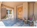 Charming front porch with decorative accents, stone archway, and inviting entrance at 8606 E Arroyo Seco Rd, Scottsdale, AZ 85266