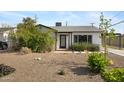 Charming single-story home with desert landscaping and inviting front entrance at 1615 E Roma Ave, Phoenix, AZ 85016