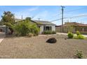 Landscaped front yard showcasing drought-tolerant plants and a well-maintained exterior at 1615 E Roma Ave, Phoenix, AZ 85016