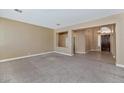 Spacious living room showcasing tile flooring leading up to a decorative wall and front entry way at 1621 W Wildwood Dr, Phoenix, AZ 85045