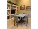 Stylish dining area boasts a modern table, seating for six, and contemporary decor on display shelving at 16820 E La Montana Dr # 105, Fountain Hills, AZ 85268