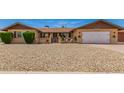 Attractive home with manicured front yard, featuring desert landscaping and an attached garage at 4145 W Hayward Ave, Phoenix, AZ 85051