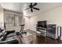 Spacious living room features wood floors and abundant natural light at 4343 N 21St St # 158, Phoenix, AZ 85016