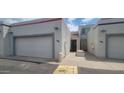 Charming townhome exterior with attached garages and desert landscaping at 4733 W Eva St, Glendale, AZ 85302