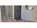 Tile front patio with security door and window at 4733 W Eva St, Glendale, AZ 85302