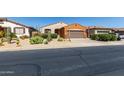 Charming home with desert landscaping, a two-car garage, and classic Southwestern architecture at 47719 N Camino Del Sol --, Gold Canyon, AZ 85118