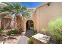 A landscaped walkway leads to the arched entryway, complemented by desert vegetation at 5505 E Mclellan Rd # 111, Mesa, AZ 85205