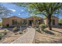 Charming single-story home featuring landscaped front yard with mature trees at 8248 E Arroyo Hondo Rd, Scottsdale, AZ 85266