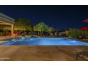 Inviting backyard pool featuring desert landscaping and clear night sky at 8248 E Arroyo Hondo Rd, Scottsdale, AZ 85266