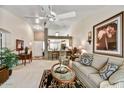 Open living room boasting high ceilings, ceiling fan and direct access to kitchen at 10347 W Mohawk Ln, Peoria, AZ 85382