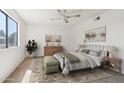 Bright bedroom featuring a comfortable bed, rug, and natural light at 1051 S 81St Way, Mesa, AZ 85208