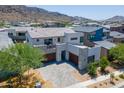 Aerial view of an impressive modern home with mountain views in a desirable neighborhood at 1221 E Paseo Way, Phoenix, AZ 85042