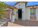Inviting entrance with brick accents, pergola, and pavers leading to the front door at 1768 E Grand Ridge Rd, Queen Creek, AZ 85140
