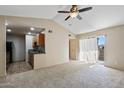 Bright living room featuring vaulted ceiling, a ceiling fan and a sliding door to the outside at 200 E Southern Ave # 368, Tempe, AZ 85282