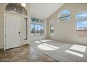 Bright living room with large windows and neutral carpet flooring at 2880 E Nunneley Rd, Gilbert, AZ 85296