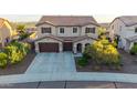 Beautiful two-story home with three-car garage, well-manicured landscaping, and a spacious driveway at 3715 W Teresa Dr, New River, AZ 85087