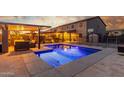 Backyard oasis with a sparkling blue pool, covered patio, and outdoor seating area at 3715 W Teresa Dr, New River, AZ 85087